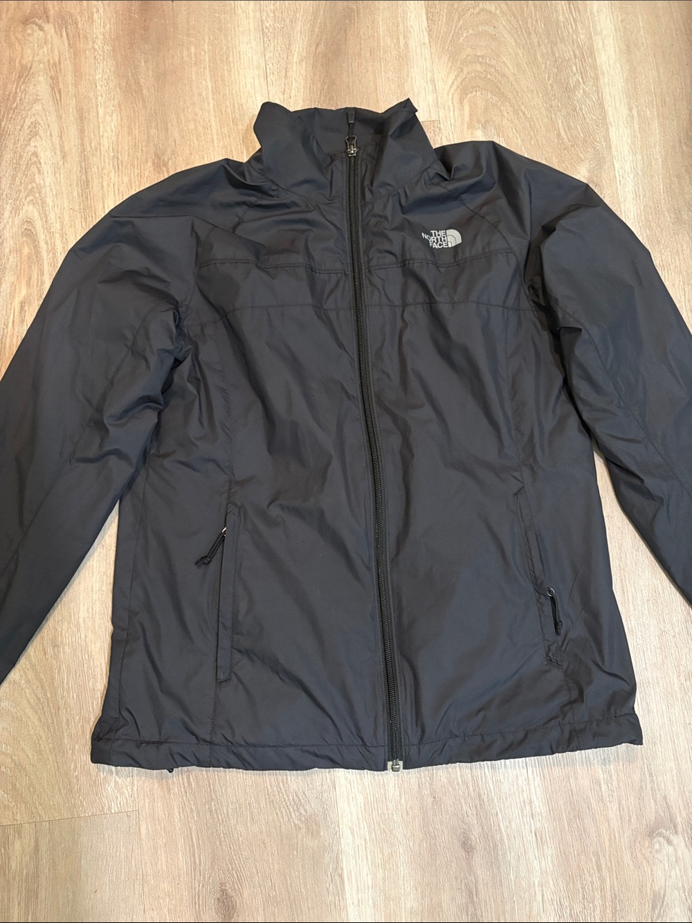 The NorthFace women’s Black Rain Jacket Medium